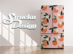 a pink refrigerator with oranges on it and the words stuck in design above it