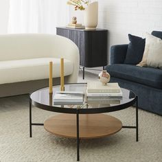 a living room with two couches and a coffee table in the middle of it