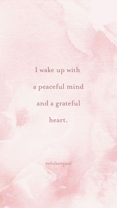 a pink watercolor background with the words i wake up with a peaceful mind and a grateful heart