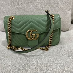 Gg Marmont Flap Bag Matelasse Leather High-end Green Crossbody Shoulder Bag, Green Gucci Travel Bag, Green Gucci Bag For Everyday Use, Luxury Green Shoulder Bag With Dust Bag, Designer Green Bags With Branded Hardware, Green Gucci Crossbody Shoulder Bag, Gucci Green Crossbody Bag, Green Gucci Crossbody Bag, High-end Green Bags With Gold-tone Hardware