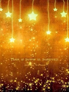 there is power in positivity with stars hanging from strings and the words above it