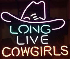 a neon sign that says long live cowgirls