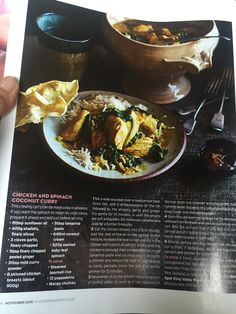 a cookbook with an image of chicken and spinach curry