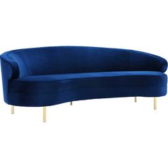 a blue couch sitting on top of a white floor