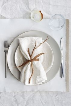 a white plate topped with a napkin and fork