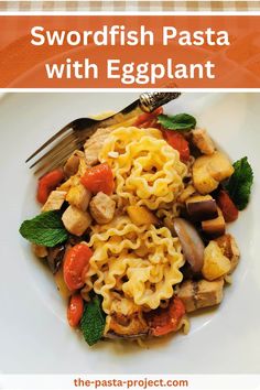 a white plate topped with pasta and vegetables