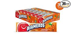 two boxes of airheads orange flavored gummy bars with an apple in the middle