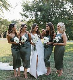 the bridesmaids are all dressed in green dresses