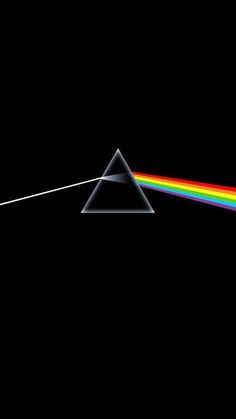 the dark side of the moon with a rainbow light coming from it