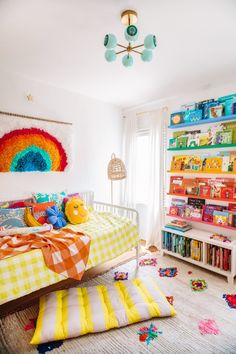 a child's bedroom decorated in bright colors