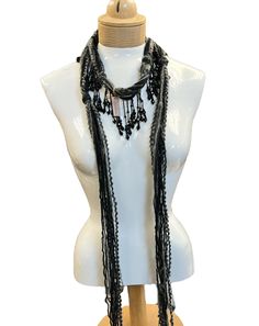 These beaded scarf necklaces are made with Italian silk yarns, Mohair and other yarns. A great accent for your holiday wardrobe. They are lightweight and comfortable to wear. Measuring 48 inches in length. A mix of black, white, and gray, with accents of beads. Comes in a linen gift pouch. Bohemian Black Handmade Scarves, Bohemian Black Handmade Scarf, Bohemian Black Handwoven Beaded Necklaces, Handmade Black Scarves As Gifts, Scarf Necklaces, Beaded Scarf, Mohair Scarf, Scarf Yarn, Scarf Necklace