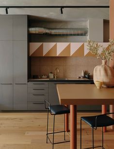 the kitchen is clean and ready to be used as a dining room or office space