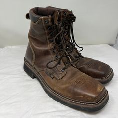 "Vintage Men 90s Brown Justin Original Work boot with steeltoe SIZE: MEN US 11 D  WIDTH: 4 1/2\" LENGTH OUTSOLE: 13 1/4\" HEEL: 1 1/2 \" HEIGHT: 9\" MATERIAL: Leather  COLOR: BROWN MADE IN USA NOTE: Shoes show signs of wear on soles, heels and uppers consistent to pre-owned shoes.  Made by Justin" Men's Leather Boots Vintage, 90s Boots Men, Sturdy Lace-up Boots For Outdoor Work, Casual Work Boots With Steel Toe, Sturdy Leather Work Boots With Snip Toe, Protective Metal Feet Closed Toe Boots For Outdoor Work, Rugged Lace-up Boots With Steel Toe, Rugged Sturdy Boots With Round Toe, Steel Toe Work Boots With Plain Toe