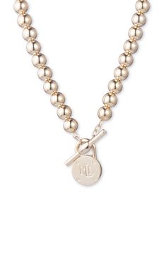 A logo-inscribed pendant brings signature style to this beautifully beaded necklace secured with a front toggle closure. Goldtone plate Imported Ralph Lauren Jewelry, Gold Collar Necklace, Padlock Necklace, Beaded Collar Necklace, Engraved Pendant, Ralph Lauren Logo, Beaded Collar, Necklace Online, Classic Gold