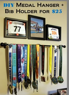 some medals are hanging on the wall and there is a sign that says diy medal hanger for $ 25