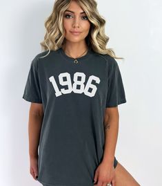 1986 Shirt, 1986 Birthday Year Number Shirt, 1986 T-Shirt, Born In 1986, Custom Birth Year Shirts, Awesome Since 1986, Minimalist 1986 Tee Get ready to be OBSESSED with your new *1986* shirt. It's the cutest and most trendy way to let everyone know how young you are !  Great as a Birthday gift! ✺ Check out the sweatshirt version of this design here: https://www.etsy.com/uk/listing/940350920/1986-birthday-year-number-sweatshirt-for?ref=listings_manager_grid * Q U I C K * F A C T S * ✺ 100% preshrunk cotton ✺ Wash and dry normally (on cool for best results) ✺ Product color may slightly vary due to photographic lighting sources or your monitor settings  * S I Z I N G * ✺ Sizing is unisex so runs like men's, though not overly large ✺ Most women find their typical size works best, since they ar 1983 Shirt, 40th Birthday Shirt, Golf Mom, Like A Rockstar, Gymnastics Mom, Swim Mom, Wrestling Mom, 40th Birthday Shirts, Number Shirt