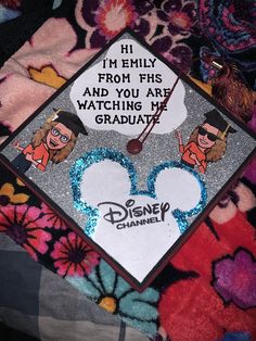 a graduation cap with the words i'm emily from fis and you are watching my graduate