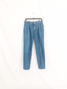 "Rare, vintage Levis pleated jeans. Soft, 100% cotton denim. Pleated front. Tapered leg. High waisted. Made in U.S.A. Clean and ready to wear. In good vintage condition. Size: tag size 31 x 32 Waist, measured at the top of the waistband laying flat and doubled: just a bit over 30\" Hips: 42\"/43\" Front rise: 11.5\" Inseam: 31\"" Pleated Jeans, Metallic Shorts, Levis Vintage, High Waisted Jeans, Vintage Levis, Fur Jacket, Tapered Legs, High Waist Jeans, Size Tag