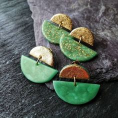 I make these fantastic green and gold clay stud earrings of lightweight Polymer clay, precious 24k gold-leaf and 22ct gold plated brass stud earrings with butterfly clasps. I have chosen the green and gold colour combination to create a modern and stylish Statement piece that is perfect for any occasion. The smaller top half circle is gilded, not only because it gives every earring a high-quality appearance, but it works as a mirror for the sun while you are wearing it.  During the baking proces Elegant Green Resin Earrings, Unique Gold Polymer Clay Jewelry, Green Gold Plated Round Earrings, Green Gold-plated Round Earrings, Green Round Gold-plated Earrings, Gold Drop Earrings With Unique Variations, Gold Polymer Clay Dangle Jewelry, Nickel Free Gold Polymer Clay Jewelry, Handmade Gold Polymer Clay Jewelry