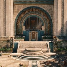 a large building with steps leading up to the front door and an arch above it