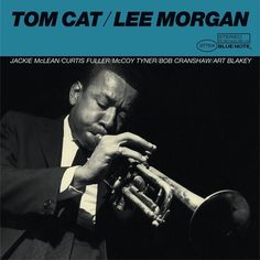 a man playing a trumpet on top of a blue sheet music cover with the caption tom cat / lee morgan