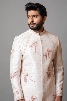 Heavenly pink sherwani with forestial themed hand embroidery, highlighted with French knots, sequins, aari work. Paired with a cream slim fit pyjama pant.
Components:2
Pattern:Embroidered
Type of Work:French knots, sequins, aari work
Neckline:Mandarin
Sleeve Length:Full Sleeves
Fabric:Raw Silk, Cotton
Color:Pink
Other Details:
Forest inspired embroidery
Occasion:Groom - Aza Fashions Pink Raw Silk Sherwani With Traditional Drape, Traditional Pink Bandhgala With Chikankari Embroidery, Pink Bandhgala With Resham Embroidery For Eid, Pink Bandhgala With Zari Work For Eid, Traditional Pink Bandhgala With Resham Embroidery, Pink Bandhgala With Chikankari Embroidery For Festive Occasions, Pink Bandhgala With Chikankari Embroidery For Festivals, Traditional Pink Sherwani With Intricate Embroidery, Festive Pink Sherwani With Zari Work