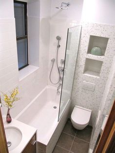 a bathroom with a sink, toilet and bathtub next to a window in it