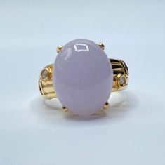 Light lavender jade ring with 6 small diamonds, 3 on each side. 14k yellow gold band. No visible cracks or chips in jade. The jade cabochon is translucent and allows light to pass through. Can be resized with your local jeweler.  Size: 9.5 Materials: 14K yellow gold, light lavender jade, diamonds  Marking: 585 14K Measurements: 1 oval jade cabonchon16mm x 12mm x 7mm, 2 diamonds 2mm x 2mm, 4 diamonds 1.5mm x 1.5mm Ring Height from Base to top of Stone: 11mm Weight: 8.82g Note: photos were taken w Lavender Jade, Light Lavender, Jade Earrings, Purple Band, Jade Ring, Gold Light, Amethyst Pendant, Lavender Color, Ring Diamond