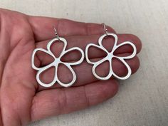 "Unique, stylish and cool mod flower earrings. They are simple and refined but also chic and fun. These earrings are timeless and perfect for everyday wear. The earrings measure 1 3/8\" long by 1 3/8\" wide and are made from plated silver. They hang from simple silver ear wire hooks. Overall drop length is 1 1/2\". I have a matching necklace in my shop, if you would like the whole set. Here is a direct link Thanks for stopping by! Please take a moment and visit the rest of my Etsy store. I have Spring Flower Shaped Nickel Free Earrings, Minimalist Drop Earrings For Spring, Spring Flower Earrings With Ear Wire, Spring Flower-shaped Nickel-free Earrings, Nickel-free Drop Flower Earrings For Spring, Spring Nickel Free Drop Flower Earrings, Nickel-free Flower Earrings For Spring, Minimalist Spring Earrings For Gift, Spring Minimalist Earrings As Gift