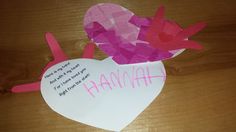 a piece of paper that has been cut out to look like a heart with the word hannah written on it