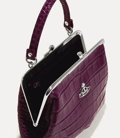 Our Granny Frame purse features a vintage-inspired silhouette and a kiss-lock closure, recalling antique coin purses from the early 20th century. The piece receives a croc-embossed finish, complete with our classic line orb motif - synonymous with Vivienne's vision for taking tradition into the future. Formal Compact Bag With Coin Pocket, Purple Vivienne Westwood, Frame Purse, Wild Beauty, Antique Coins, Into The Future, Coin Purses, Pump Sandals, Platform Pumps