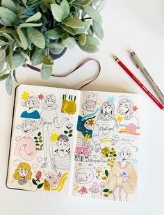 two notebooks sitting on top of a white table next to a plant and pencil