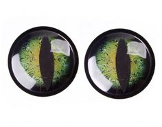 two pairs of green and yellow eyeballs in black plastic cases on a white background