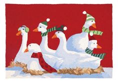 four ducks wearing christmas hats and scarfs in the snow with one sitting on top of another