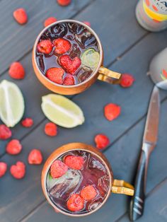 two mugs filled with raspberry lemonade and mint tea on a table