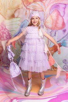 Step into the ethereal elegance of the Zenith Tulle Dress, where celestial beauty meets timeless grace. Layers of soft, flowing tulle cascade from top to bottom. Delicate embellishments adorn the frilly sleeves and neckline. Let your little one shine in this delightful A-line gown. Shipping and Returns This product can be returned/exchanged within 20 days of receiving the item. All orders are dispatched from our Sydney, Australia warehouse. SHIPPING EST. TIMEFRAME FREE FOR ORDERS OVER Internatio Frilly Sleeves, Ethereal Elegance, Pastel Lilac, Net Fabric, A Line Gown, Sydney Australia, Tulle Dress, Dhl Express, Pretty Wallpapers