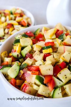 two bowls filled with chopped vegetables on top of a table