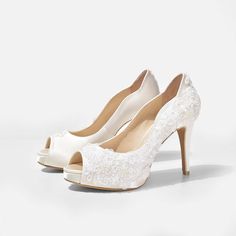 La France Ivory Lace Wedding Shoe is a pair of gorgeous handmade wedding shoes. This pair of peep toe pumps is adorned with rose floral lace patterns at the toe box. This ivory satin bridal heels are handcrafted from high quality satin, embroidered lace, fabric, genuine cow leather and other man made materials. The elevated hidden platform in front and the fully padded footbed makes the shoes extra comfy during prolonged wear. They come embellished with Swarovski crystal elements on top of the l Wedding Shoes White, Shoes Beaded, Peep Toe Wedding Shoes, Lace Wedding Shoes, Glamourous Heels, Bridal Boots, Bohemian Sandals, Wedding Shoes Comfortable, Ivory Wedding Shoes