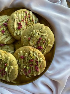 some cookies are on a plate with sprinkles