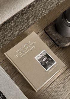 a book sitting on top of a wooden table