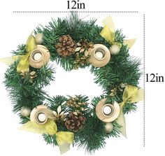 a christmas wreath with pine cones and candles