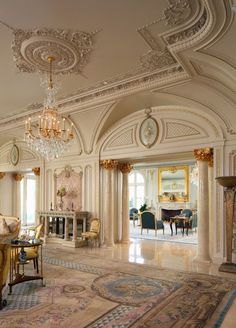 an ornately decorated living room with chandelier