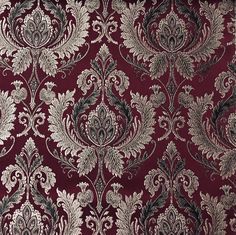 a red and silver wallpaper with an ornate design on it's surface,