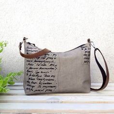 "The letter" print - An unpretentious little bag for every woman. This is a crossbody bag that stands out for its compactness and lightweight construction. Made of thick natural canvas. Sturdy bag in Gray color with a slight beige tint. ** Vintage Print - Handmade on the front, ** Simple minimalist design, ** Light weight, ** The natural traces that the canvas has give a unique cowboy nuance, ** The long handle is made of synthetic leather and lined with textile tape - for better slip on the bod Brown Letter Print Shoulder Bag For Everyday Use, Brown Shoulder Bag With Letter Print For Everyday Use, Everyday Satchel Shoulder Bag With Letter Print, Everyday Letter Print Satchel Shoulder Bag, Literary Style Letter Print Bag, Grey Crossbody Bag, Boho Purse, Boho Purses, Design Light