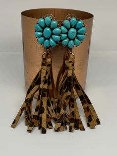 Leopard print and fringe make these earrings a must have! The tassels are made from high quality faux leather and the inlaid turquoise in either cream or blue adds a great pop of color. Approximately 4 inches in length. Turquoise Fringe Tassel Drop Earrings, Bohemian Turquoise Tassel Earrings, Turquoise Beaded Fringe Dangle Tassel Earrings, About Teachers, Turquoise Earrings, Blue Cream, Leopard Print, Tassels, Color Pop