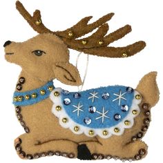 an ornament shaped like a deer wearing a blue dress with gold sequins