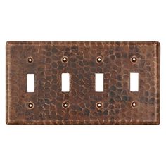 an old metal switch plate with three holes