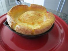 a pot pie sitting on top of a red plate