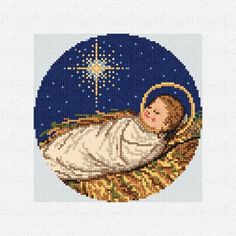 a cross stitch christmas card with an image of a baby jesus in the manger