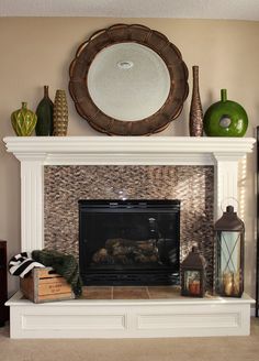 a living room with a fire place and decorative items on the mantle